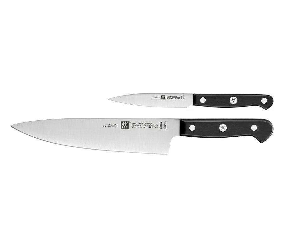 Zwei Messer aus dem ZWILLING Gourmet-Messer-Set mit schwarzen Griffen und silbernen Klingen.