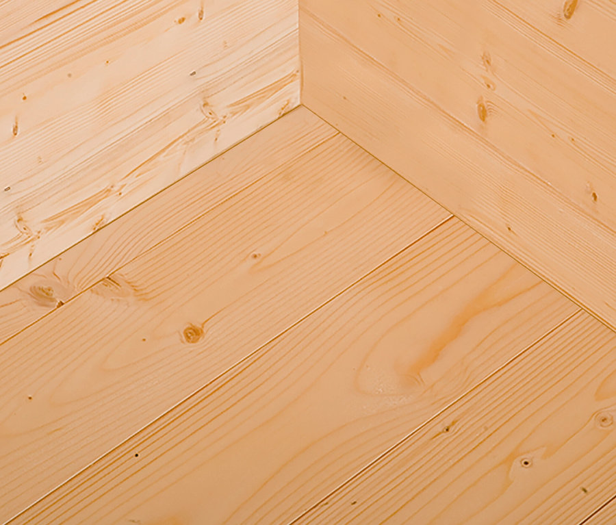 Detailaufnahme einer Wand und eines Fußbodens aus Brettern des Weka Designhauses mit Schlafboden »M445A«.