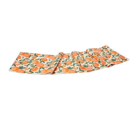 Baumwoll-Tischläufer mit Orangen- und Blättermuster.