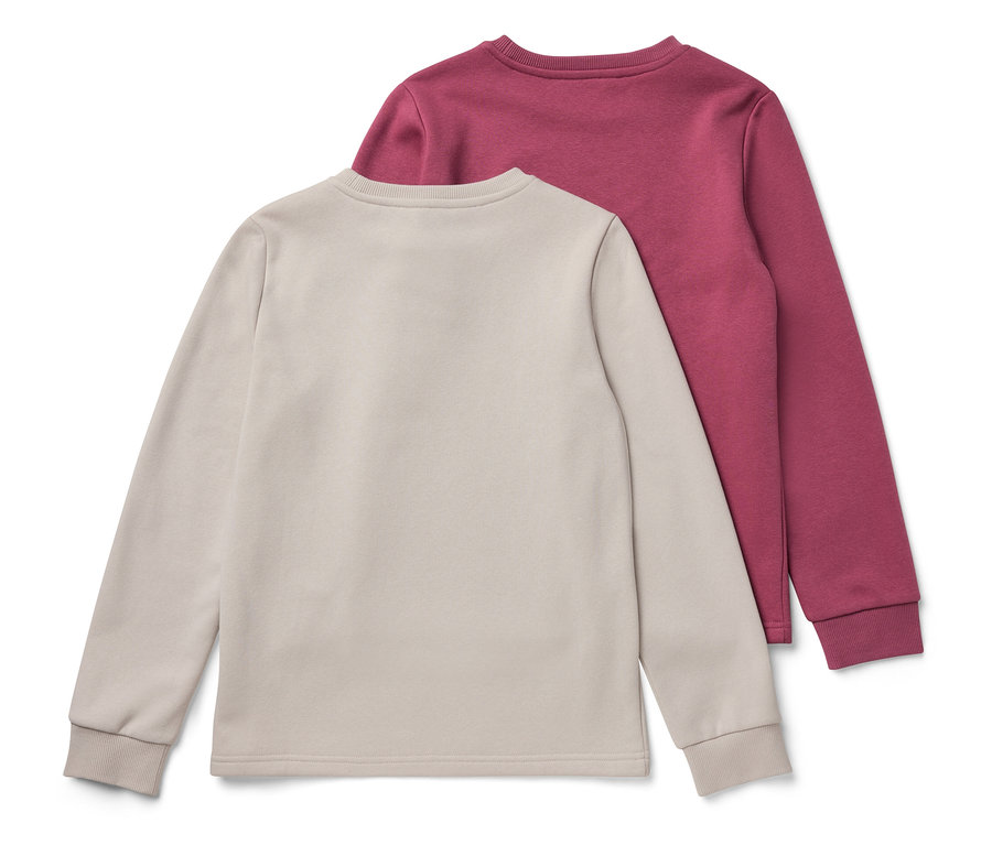 Zwei Kinder-Sweatshirts mit angerauter Innenseite, rosa und weiß.
