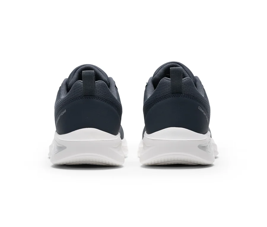 Zwei dunkelgraue Sportschuhe mit weißen Sohlen, von hinten gesehen. Am linken Schuh steht „COMFORT FOAM“, am rechten „COMFORT“.