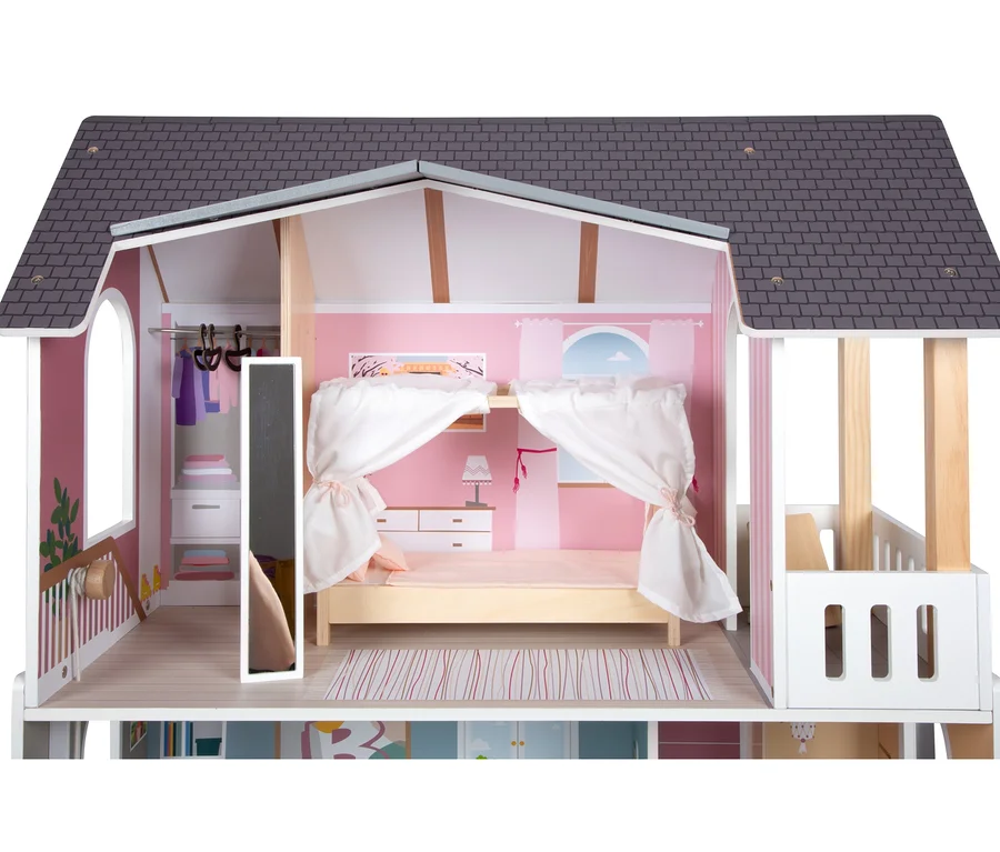 Detailansicht des teilweise geöffneten small foot Puppenhauses Stadtvilla, das Schlafzimmer und Ankleidezimmer zeigt.