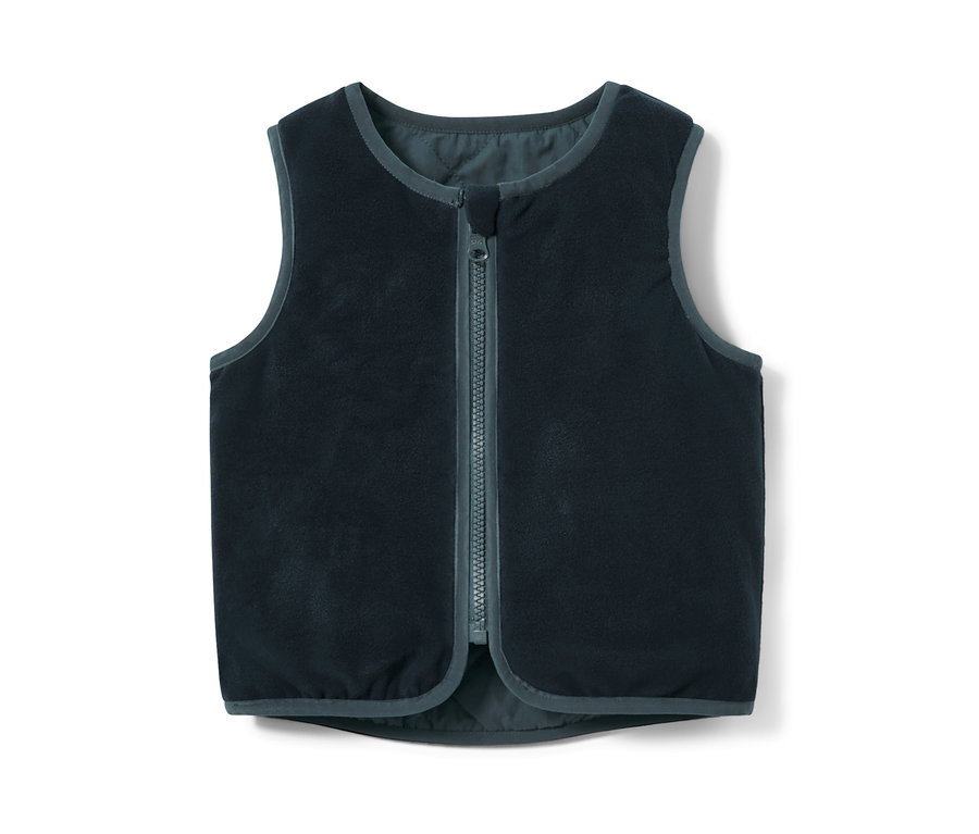 Eine marineblaue Kinder-Wendesteppweste mit einem Reißverschluss in der Mitte.
