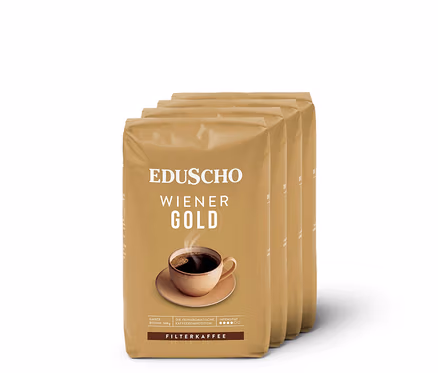 Vier Packungen Eduscho Wiener Gold 4x 500g ganze Bohne Kaffee auf weißem Hintergrund.