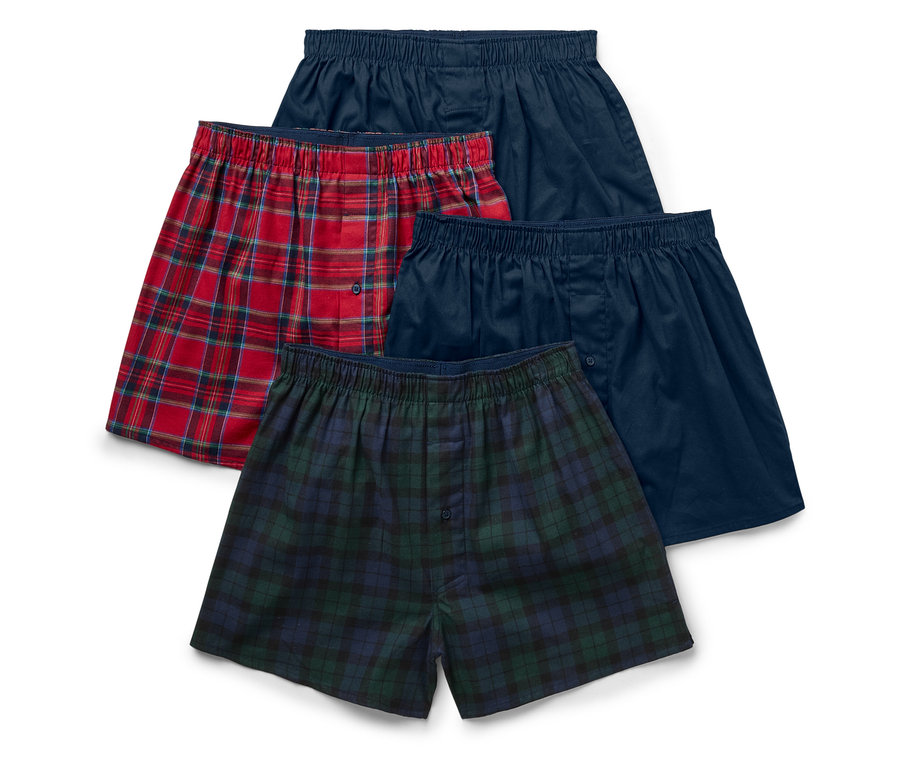 Vier Herren-Boxershorts mit Gummibund: zwei blaue, eine rot karierte und eine grün karierte.