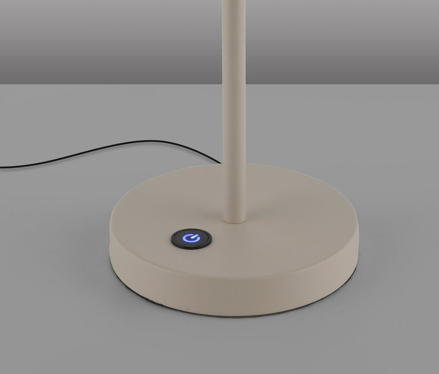Beiger Lampenfuß mit blau leuchtendem Ein-/Ausschalter und schwarzem Kabel.