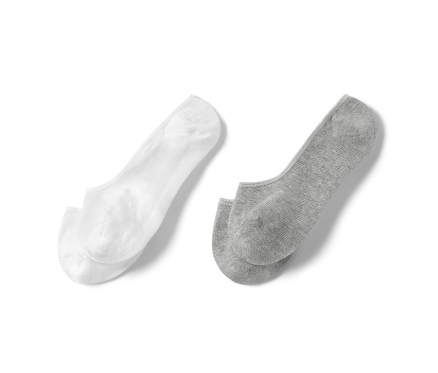 Zwei Paar Sneaker-Füßlinge, ein Paar in Weiß und ein Paar in Grau.