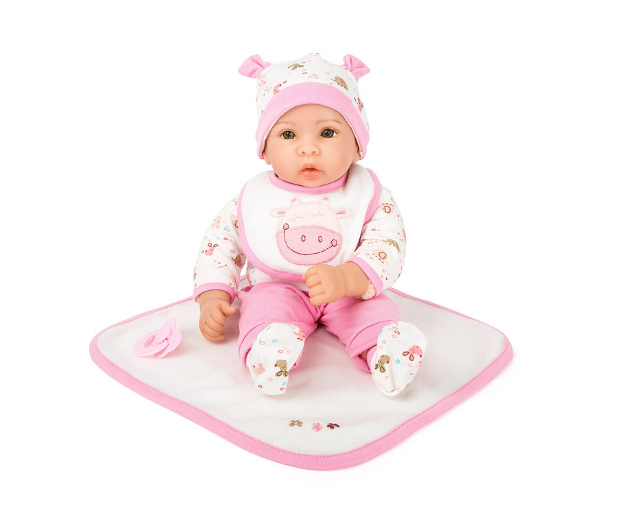 Sitzende small foot Puppe "Hanna" mit Schnuller auf einer Decke.