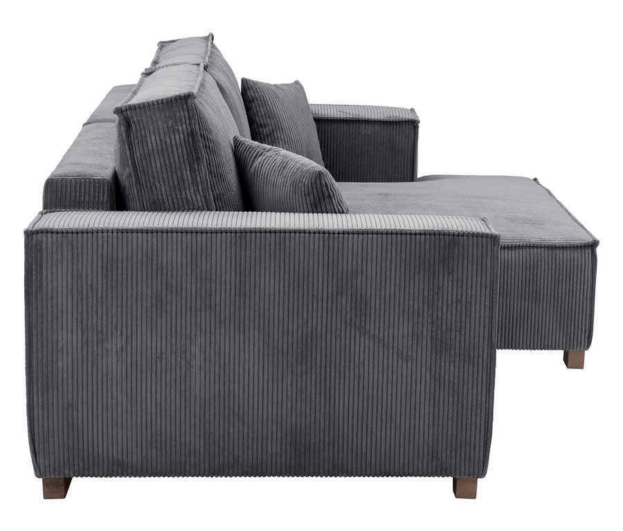 Graues Cordsofa mit Kissen und Ottomane auf Holzbeinen.