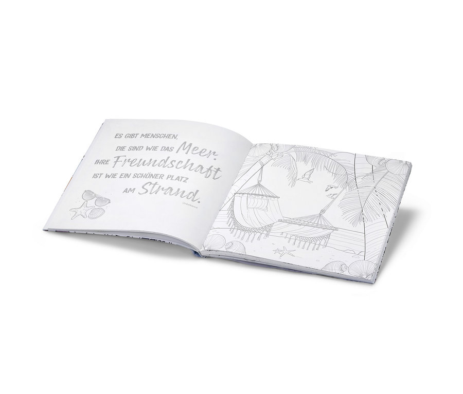 Offenes Buch »Oase der Ruhe – ausmalen und entspannen« mit Strandbildern und Text.