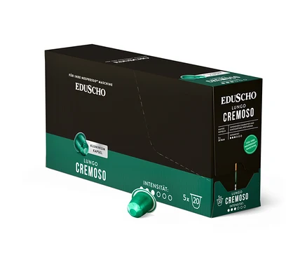 Eine Packung EDUSCHO Lungo Cremoso Kaffeekapseln mit einer einzelnen grünen Kapsel davor.