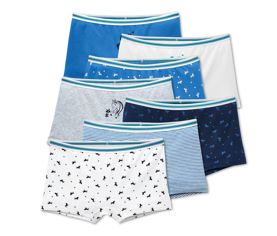 Ein Set aus sieben Mädchen-Pantys in verschiedenen Farben und Mustern.