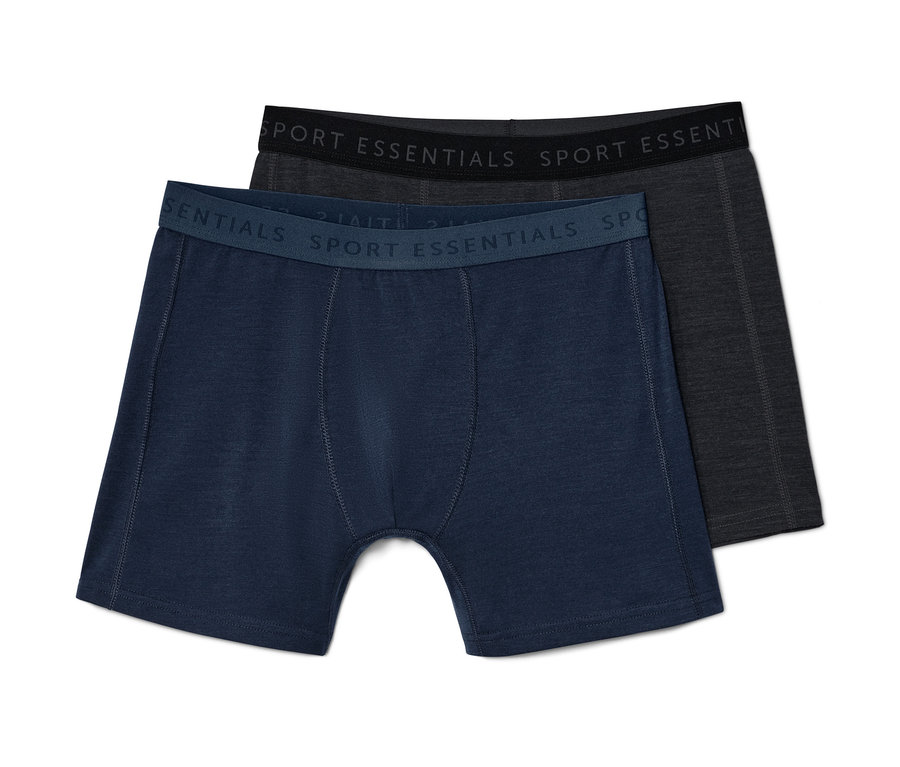 Zwei blaue Slipboxer mit Merinowolle liegen übereinander.
