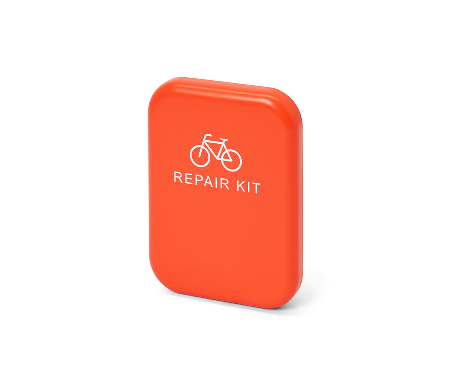 Orangefarbenes Fahrrad-Reparatur-Set mit Fahrrad-Bild.