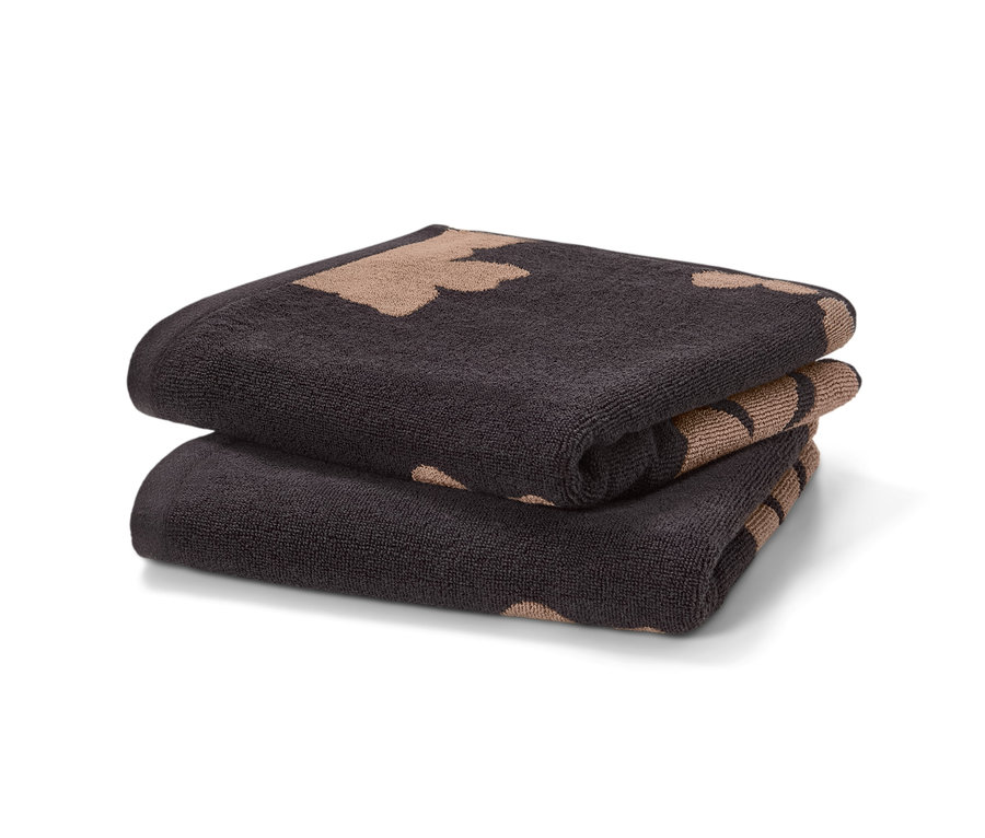 Zwei schwarze Jacquard-Handtücher, 2 Stück, liegen gefaltet aufeinander.