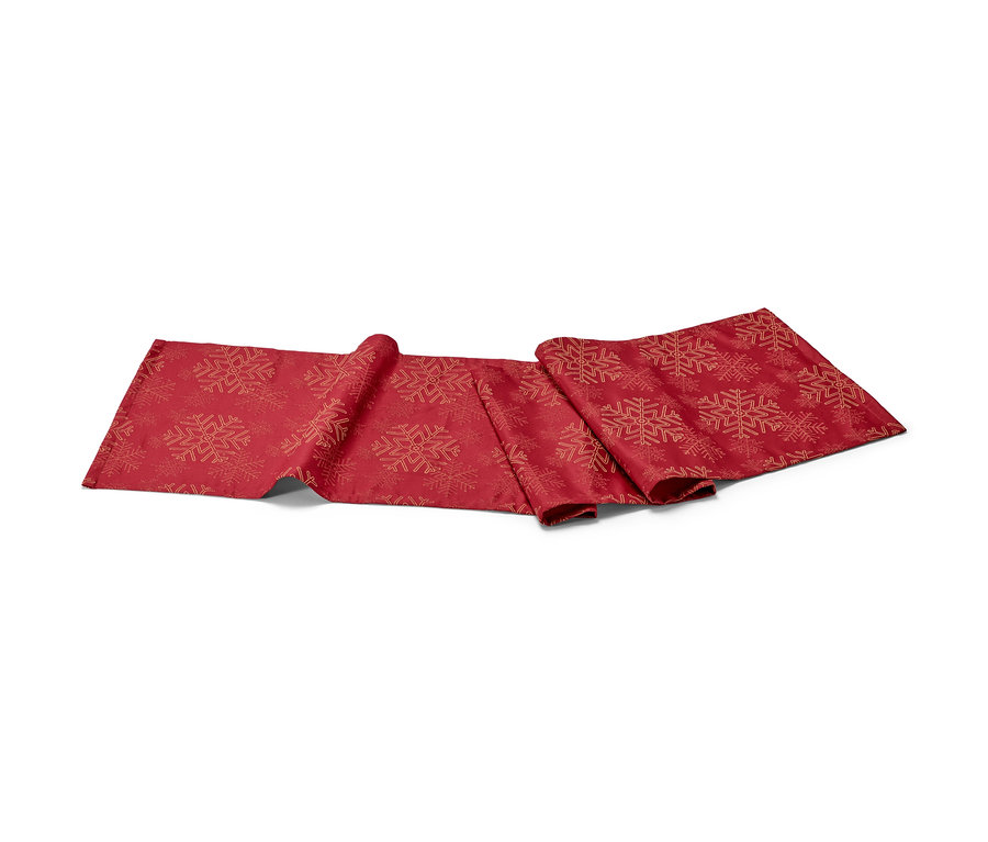Ein roter Jacquard-Tischläufer mit Schneeflockenmuster.
