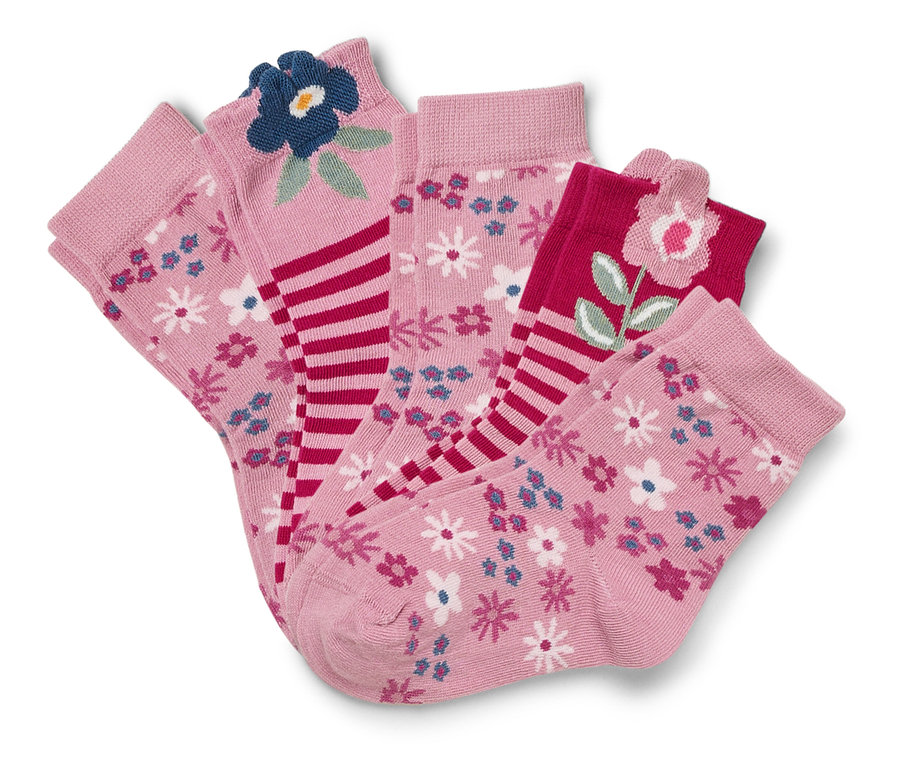 Vier Paar rosa Socken mit Blumenmustern.