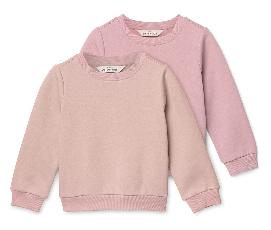 Zwei rosafarbene Kinderpullover liegen übereinander.