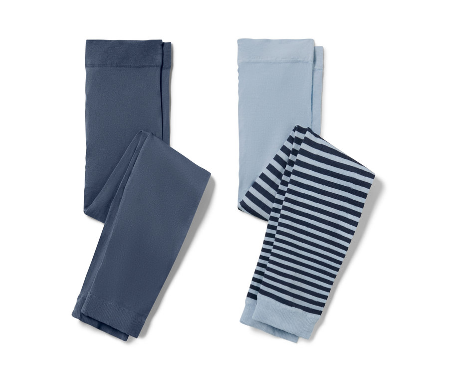 Zwei Kinder-Feinstrumpf-Leggings: eine dunkelblau, die andere hellblau mit dunkelblauen Streifen.