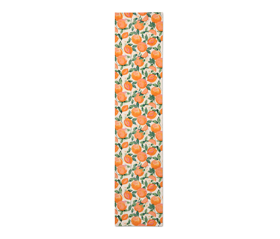 Baumwoll-Tischläufer mit Orangen- und Blättermuster.