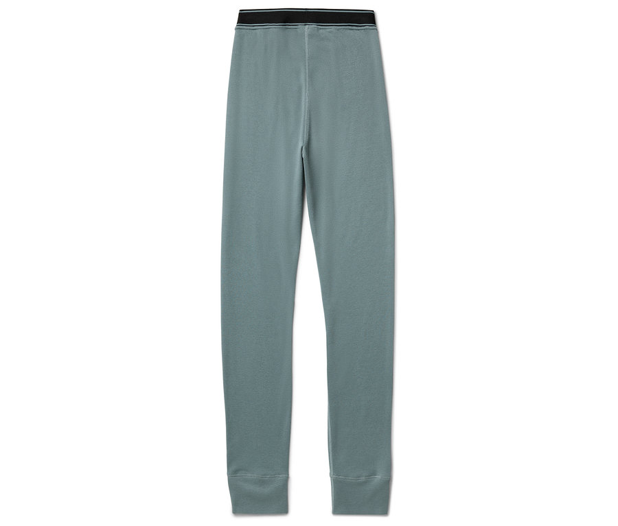 Blaue Leggings mit schwarzem Bund liegen auf einem weißen Hintergrund.