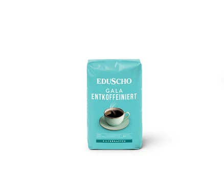 Eine Packung EDU Gala entkoff. 500g Ventil mit einer Tasse Kaffee auf der Verpackung.