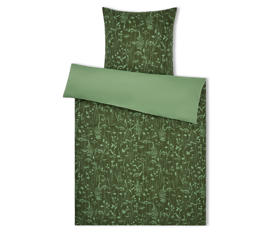 Grüne Bettwäsche mit Blumenmuster und grünem Rand.