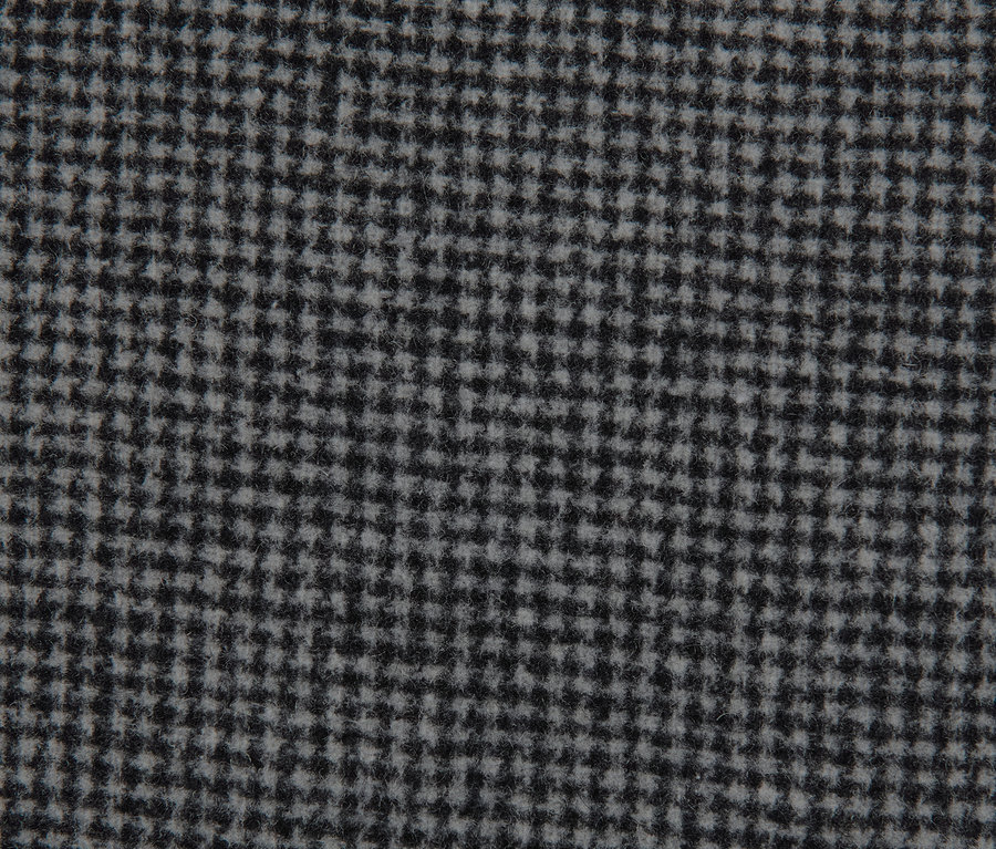 Detailaufnahme eines karierten Kurzmantel-Stoffs.