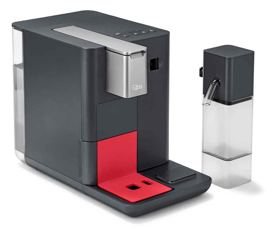 Ein grauer Kaffeeautomat mit roter Ablagefläche und Milchbehälter.