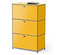 Gelber Schrank mit drei Schubladen und einem Buch darauf.