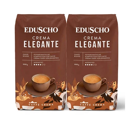 Zwei braune Packungen Eduscho Crema Elegante Kaffee mit einer Tasse Kaffee.