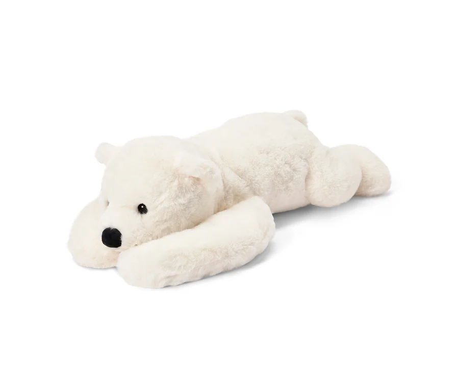 Weißes, flauschiges Plüschtier in Form eines Eisbären, das auf dem Bauch liegt, mit schwarzen Augen und Nase.