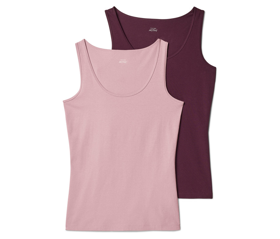 Zwei Tanktops, eins rosa und eins weinrot, liegen übereinander. Beide haben einen runden Ausschnitt und sind ärmellos.