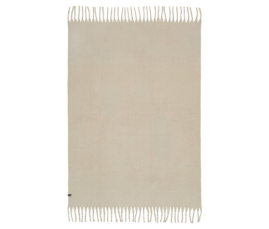 Beige Decke mit Fransen an den Rändern.