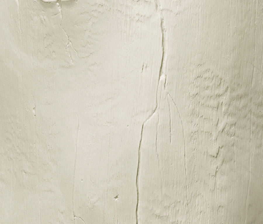 Nahaufnahme einer beigen, strukturierten Oberfläche.