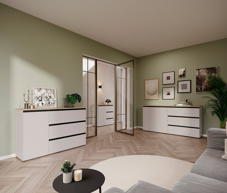 Wohnzimmer mit Kommode »Cormano«, klein, in Weiß mit drei Schubladen und Holzplatte. Eine weitere Kommode steht im Hintergrund.