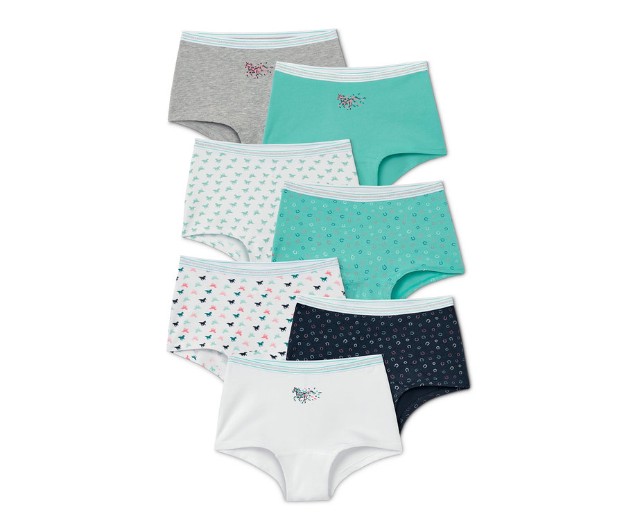Sieben Mädchen-Pantys in verschiedenen Farben und Mustern sind übereinander gestapelt.
