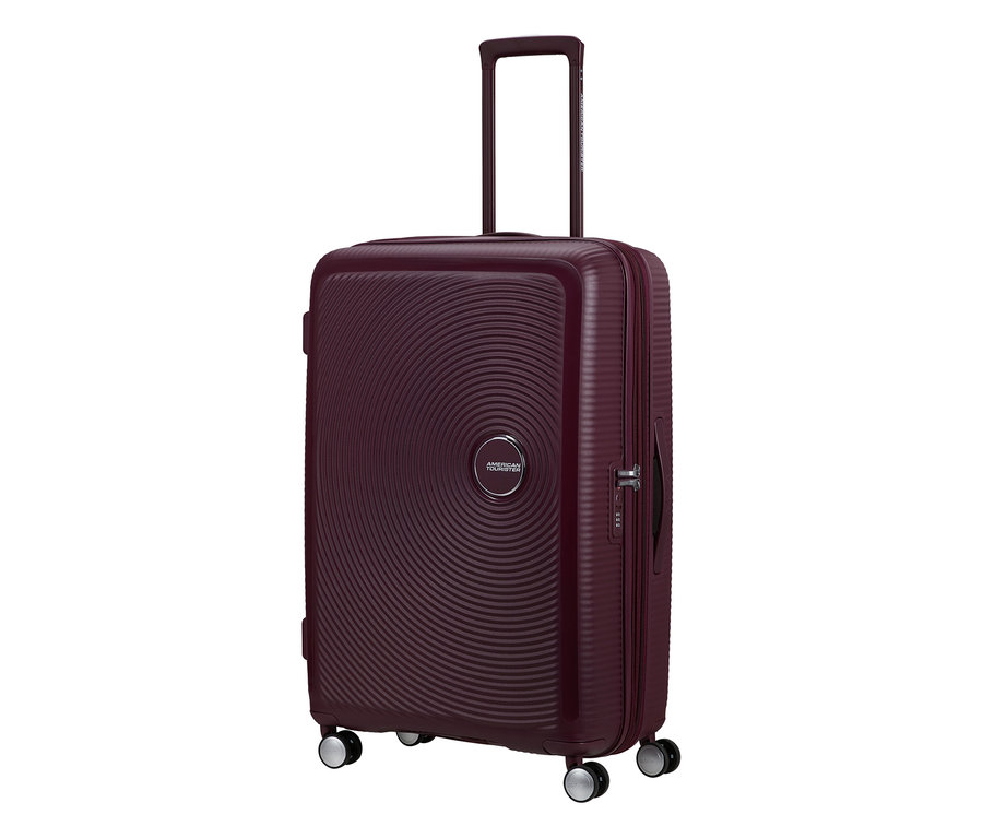 Großer American Tourister Hartschalen-Koffer Soundbox Spinner in Wildkirschrot mit konzentrischen Kreisen und ausziehbarem Griff.