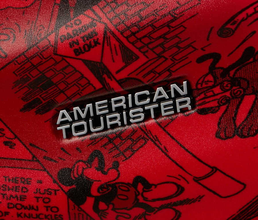 Detailaufnahme eines roten American Tourister Wavebreaker »Mickey Mouse« Koffers mit schwarzen Comiczeichnungen.