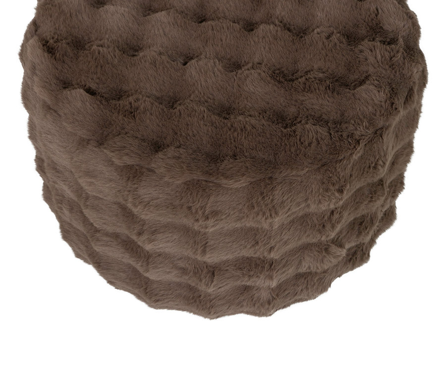 Nahaufnahme eines braunen, runden Ottomanen mit Fell.
