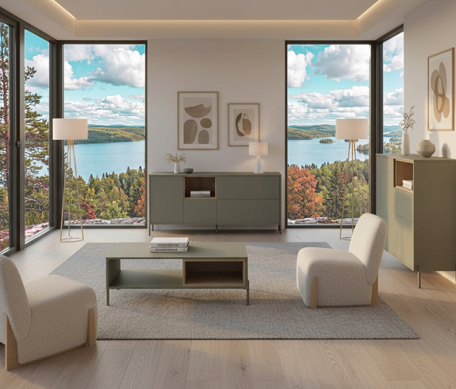 Wohnzimmer mit salbeigrünem »Hygge« Sideboard mit 1 Tür, Sesseln, Teppich und Blick auf einen See.
