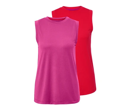 Zwei Sporttops, eines rot und eines pink, liegen übereinander.
