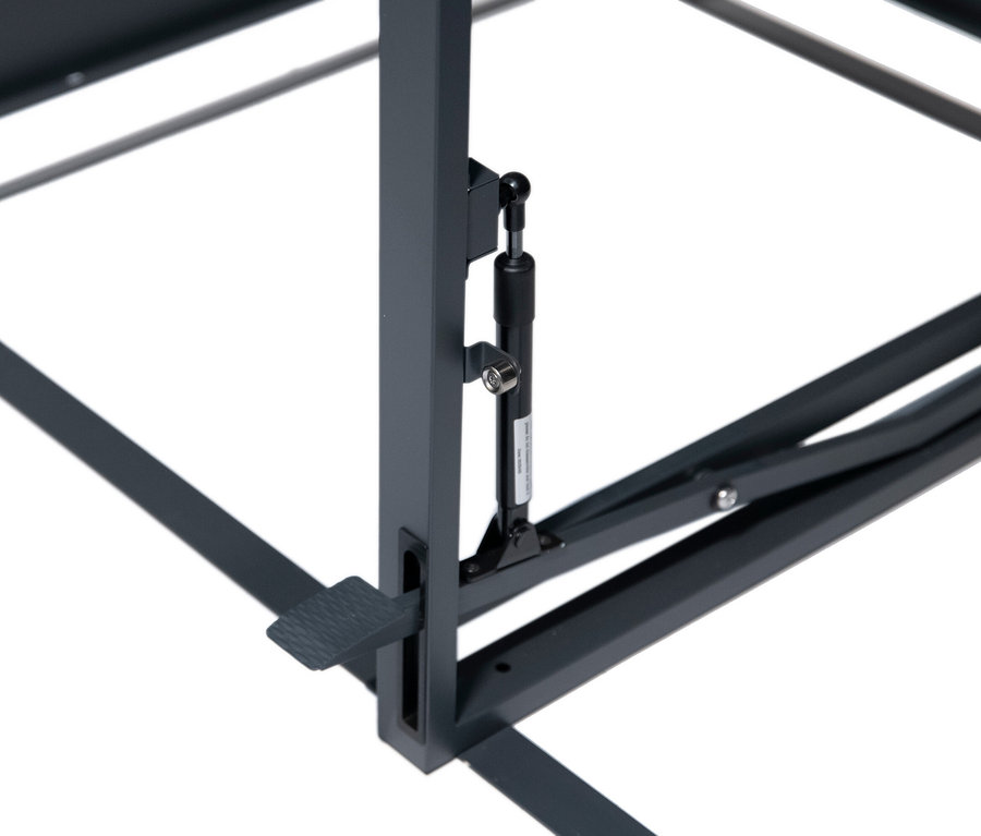 Detailansicht eines grauen Metalltischgestells mit Ausziehmechanismus.