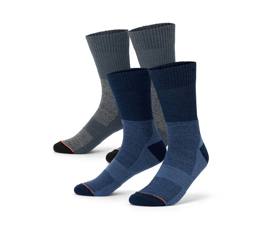Zwei Paar Trekking-Socken mit Merinowolle in Grau und Blau.