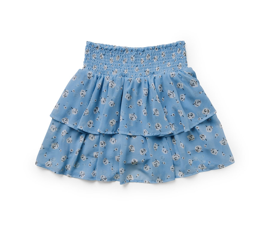 Ein blauer Kinder-Stufenrock mit Blumenmuster.