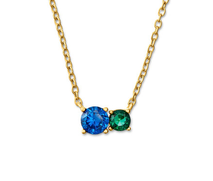 Goldkette mit blauem und grünem Stein.