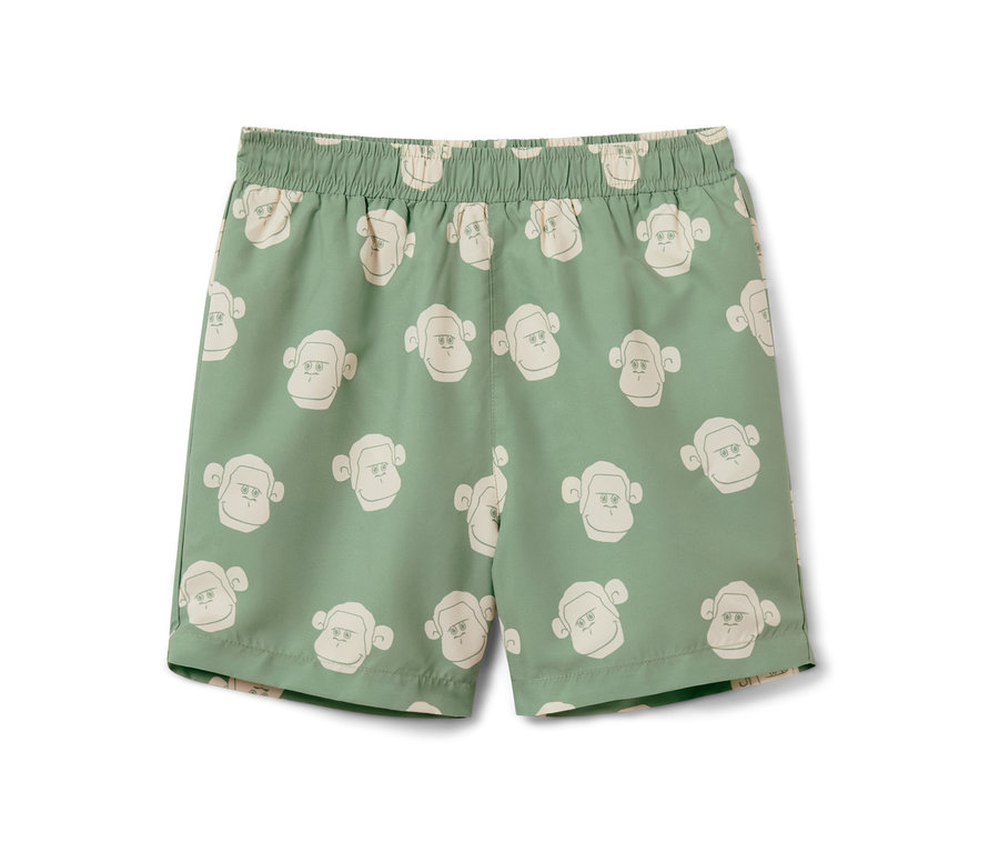 Grüne Kinder-Boardshorts mit Affenmuster.