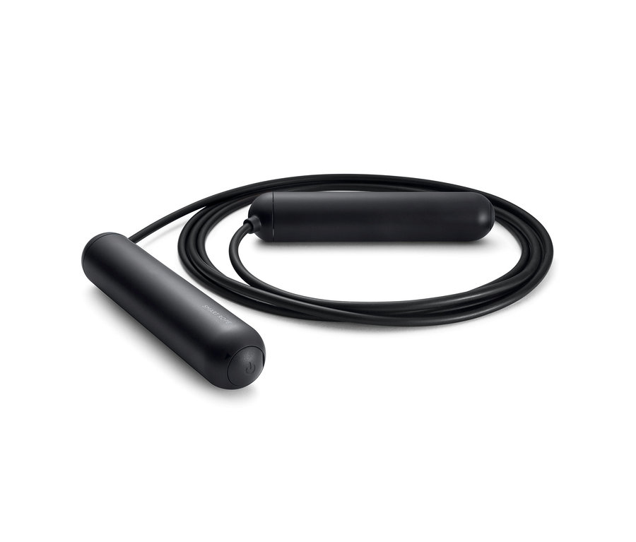 Ein schwarzes Tangram Smart Rope Springseil liegt auf einer weißen Oberfläche.
