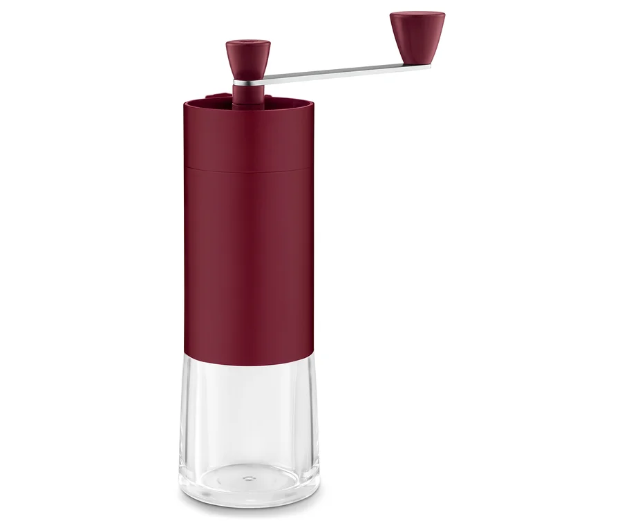 Eine Kaffeemühle manuell, berry, mit Drehgriff und transparentem Unterteil.