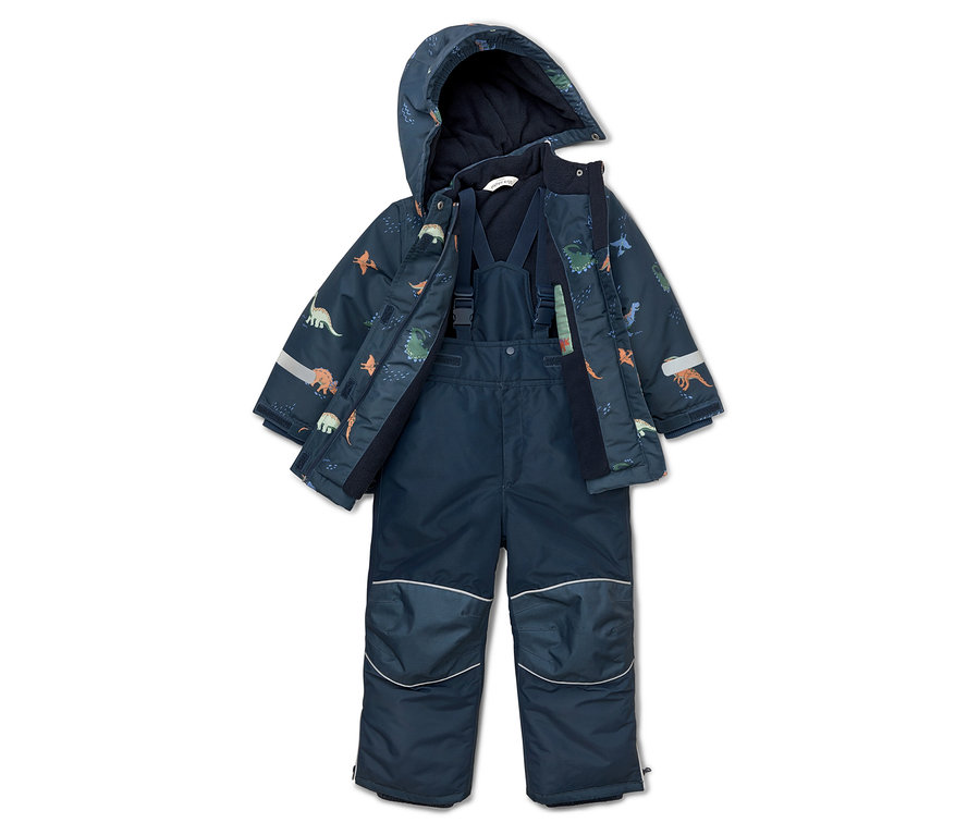 Marineblauer Schneeanzug mit Dinosaurier-Muster, offene Jacke mit Kapuze und Trägerhose liegen auf dem Boden.
